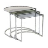 A chrome nest of three tables,