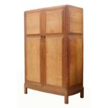 An Arts and Crafts oak wardrobe,