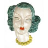 A Goldscheider pottery wall mask,