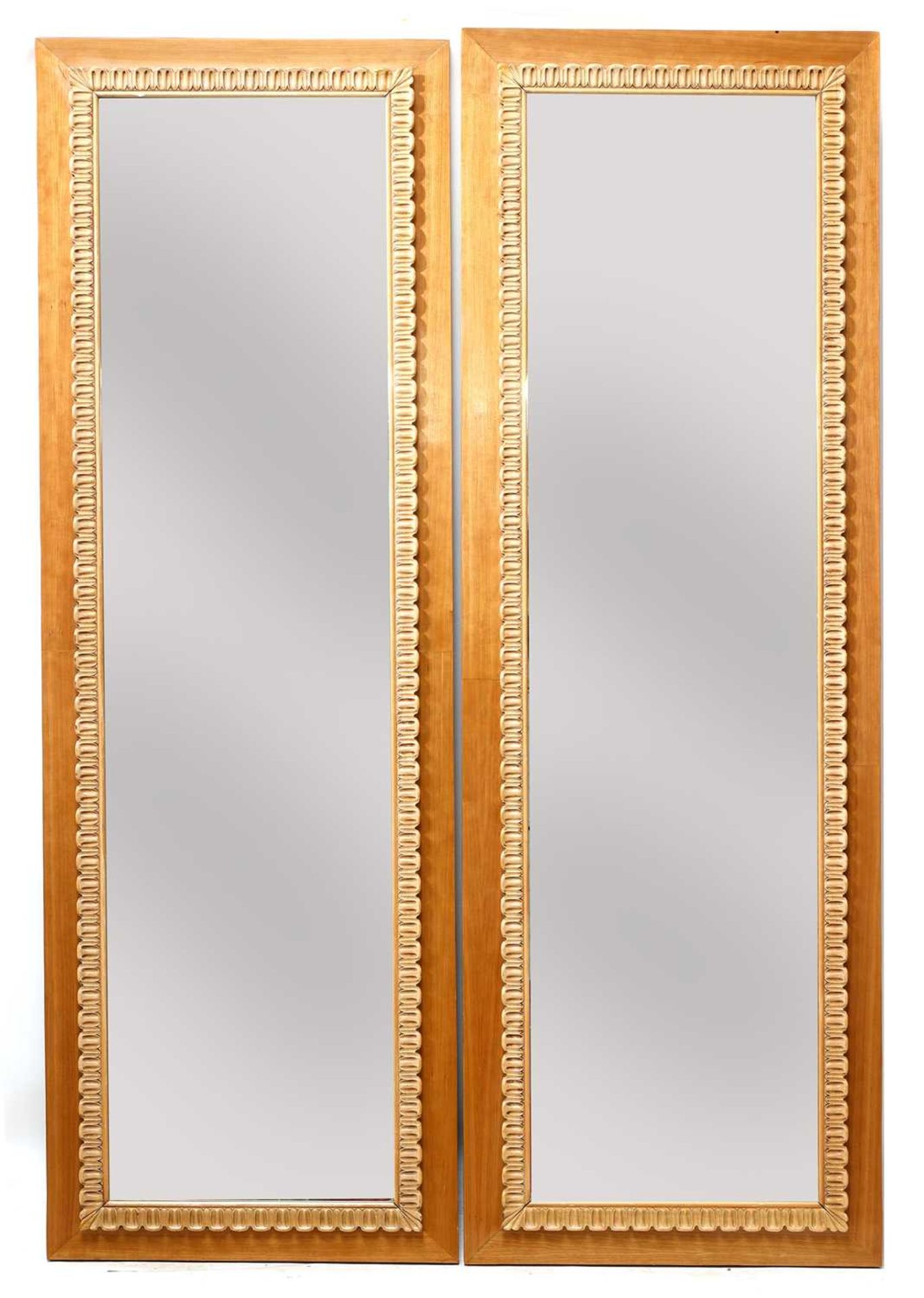 A pair of Italian walnut mirrors,