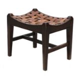 An Arts and Crafts oak stool,