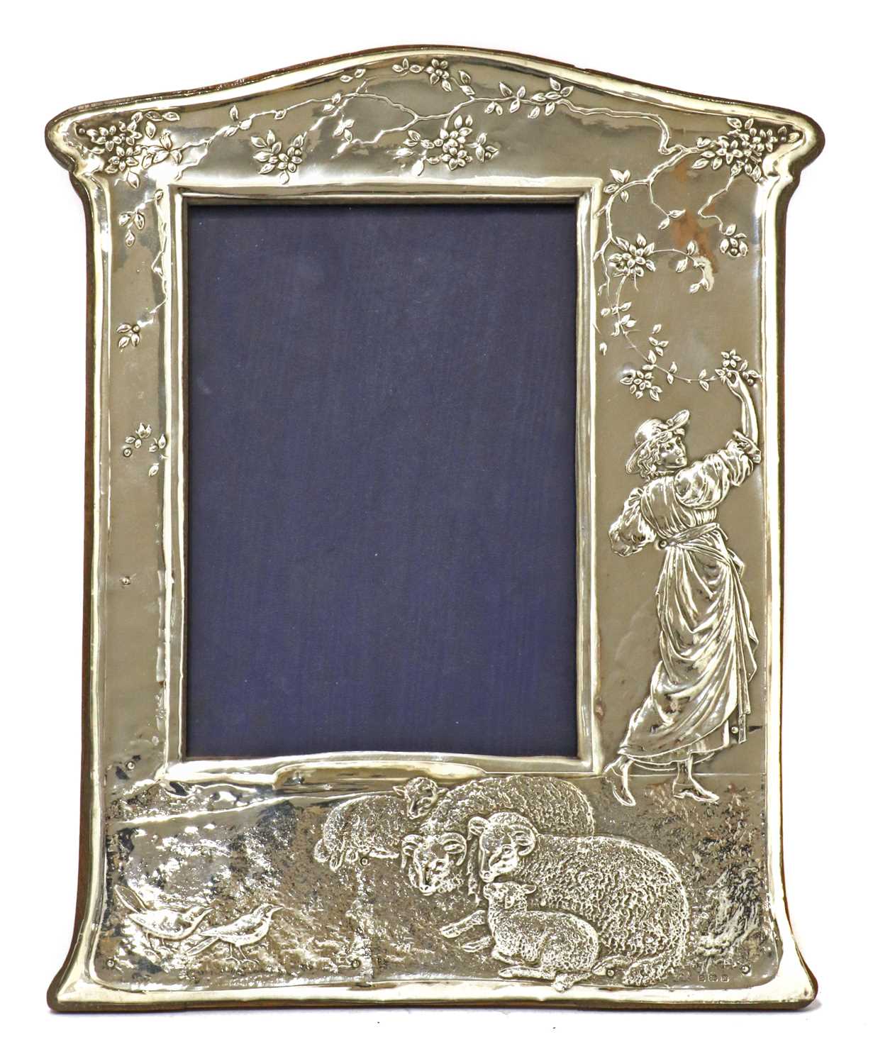 An embossed silver easel-back photograph frame,