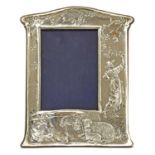 An embossed silver easel-back photograph frame,
