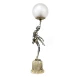 A figural table lamp,