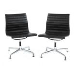 A pair of Eames 'EA105' chairs,