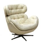 A white leather armchair,