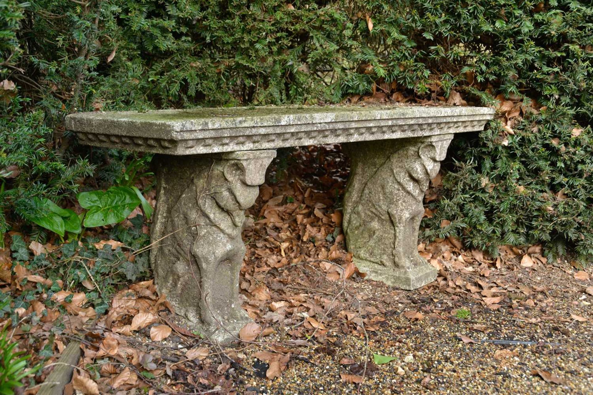 A pair of reconstituted stone garden seats,