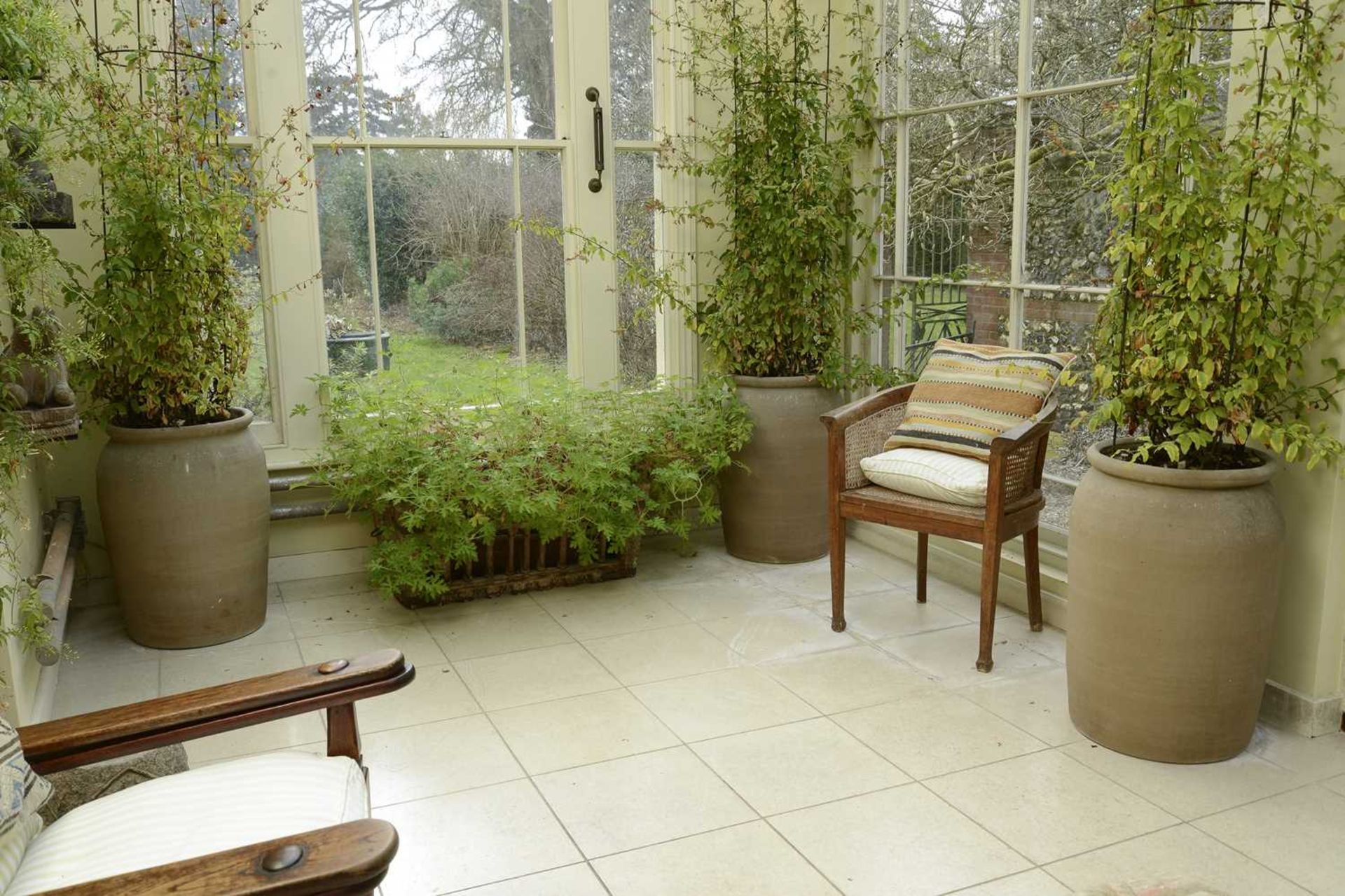 A set of four large stoneware planters,