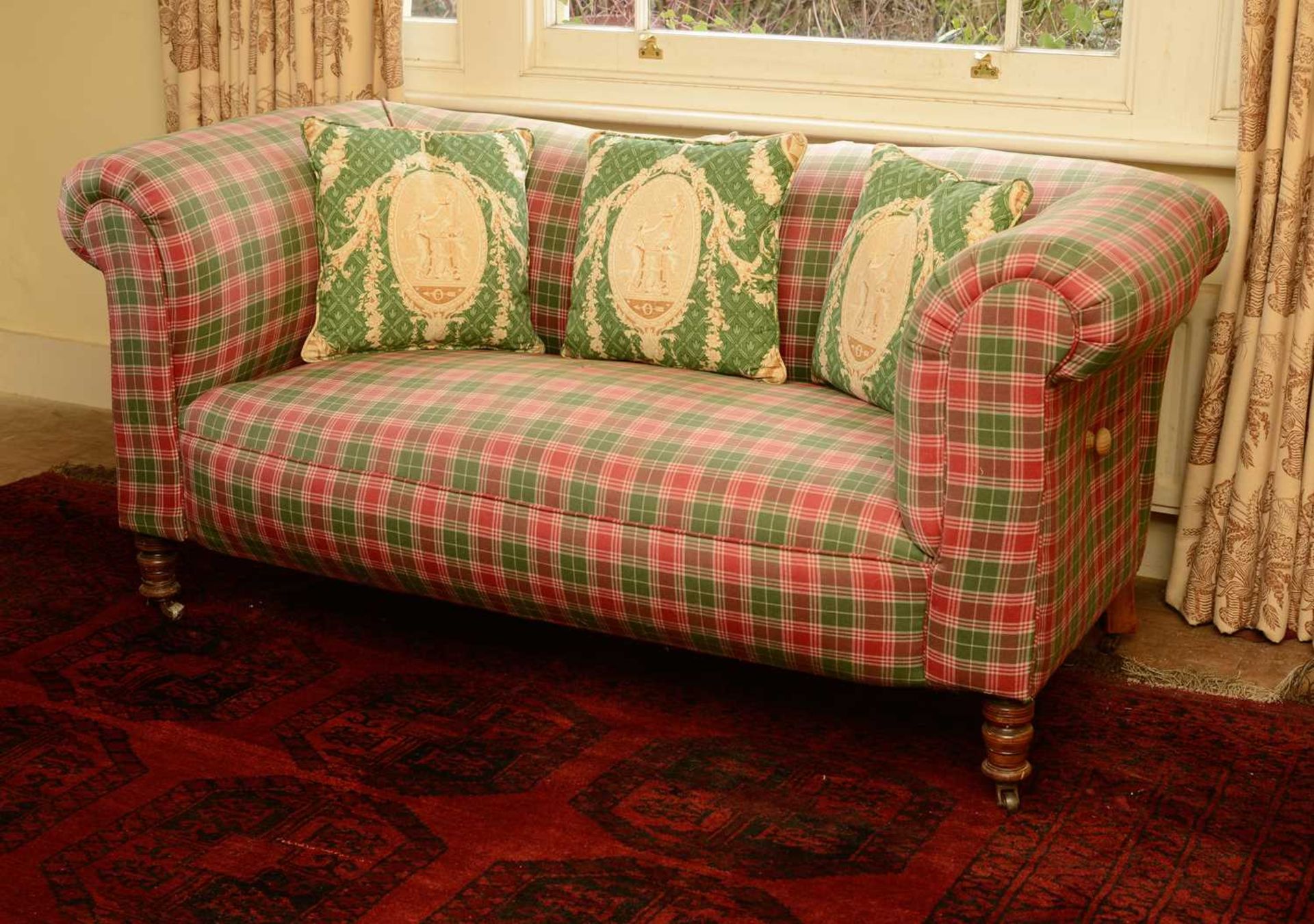 A drop-arm chesterfield settee,