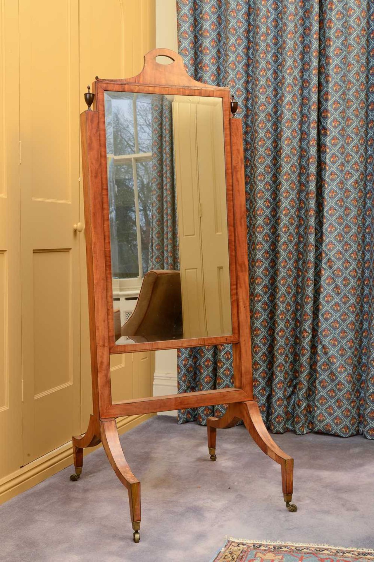 A Regency-style mahogany cheval mirror,