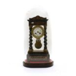 An ebonised and walnut inlaid portico clock,