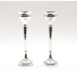 A pair of silver spill vases,