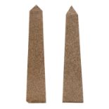 A pair of large granite obelisks,