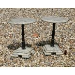 A pair of small marble and cast iron tables