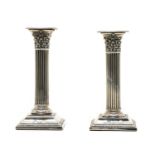 A pair of modern dwarf silver pillar candlesticks,