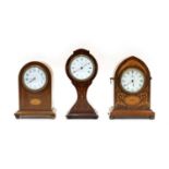 An Edwardian walnut lancet shaped mantle clock,