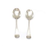 A pair of George III silver serving spoons,