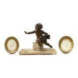 A faux bronze model of a young boy,