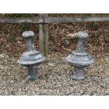 A pair of lead finials or capitals,