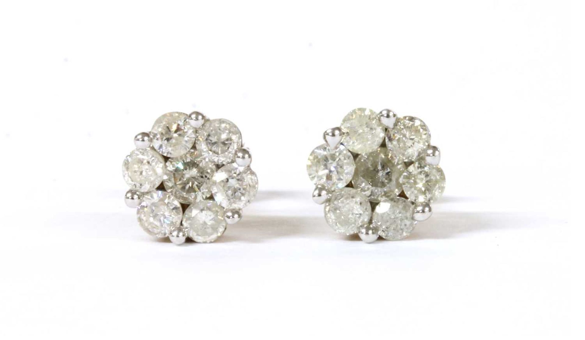 A pair of gold diamond daisy cluster earrings,
