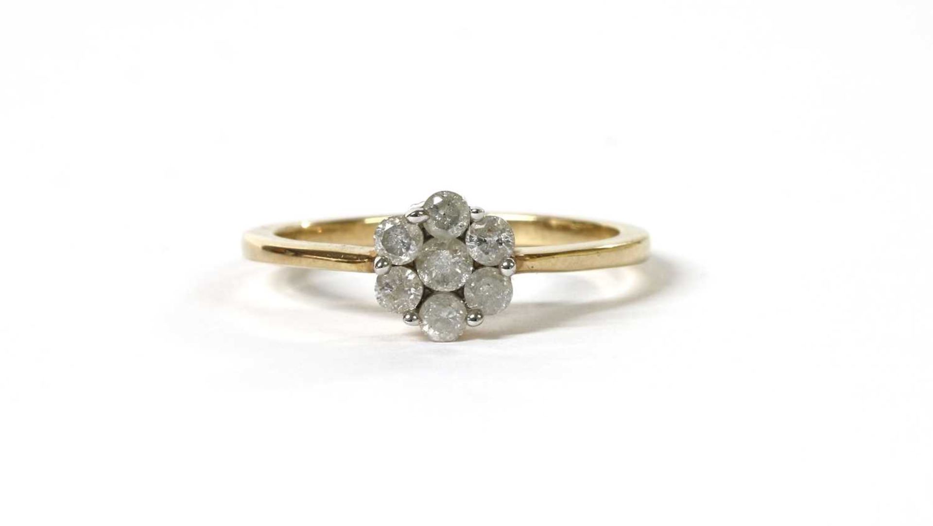 A gold diamond daisy cluster ring,