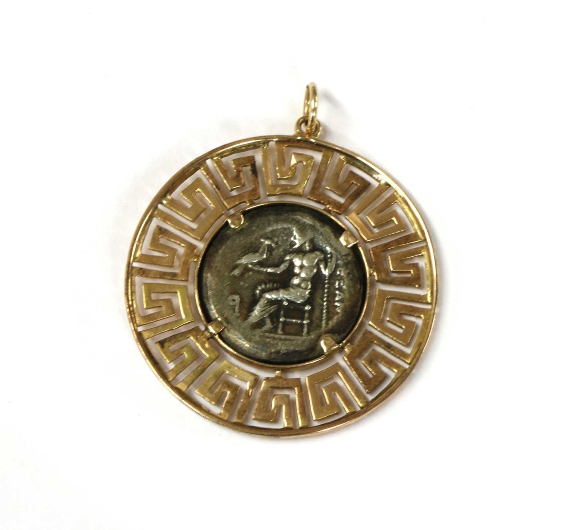 A gold and silver pendant,