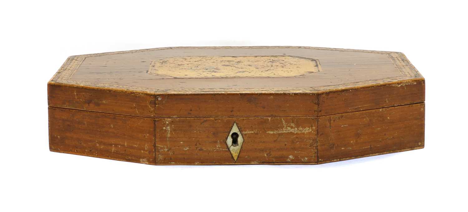A 19th century wooden games box with mother of pearl gaming counters