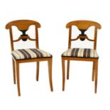 A pair of Biedermeier maple side chairs,
