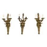 A set of three French Louis XVI-style gilt metal wall lights,