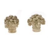 A pair of composite stone post finials,
