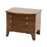 A small mahogany bowfront chest of three drawers