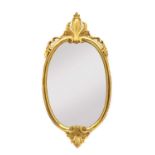 A continental giltwood oval mirror