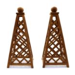 A pair of hardwood obelisks,