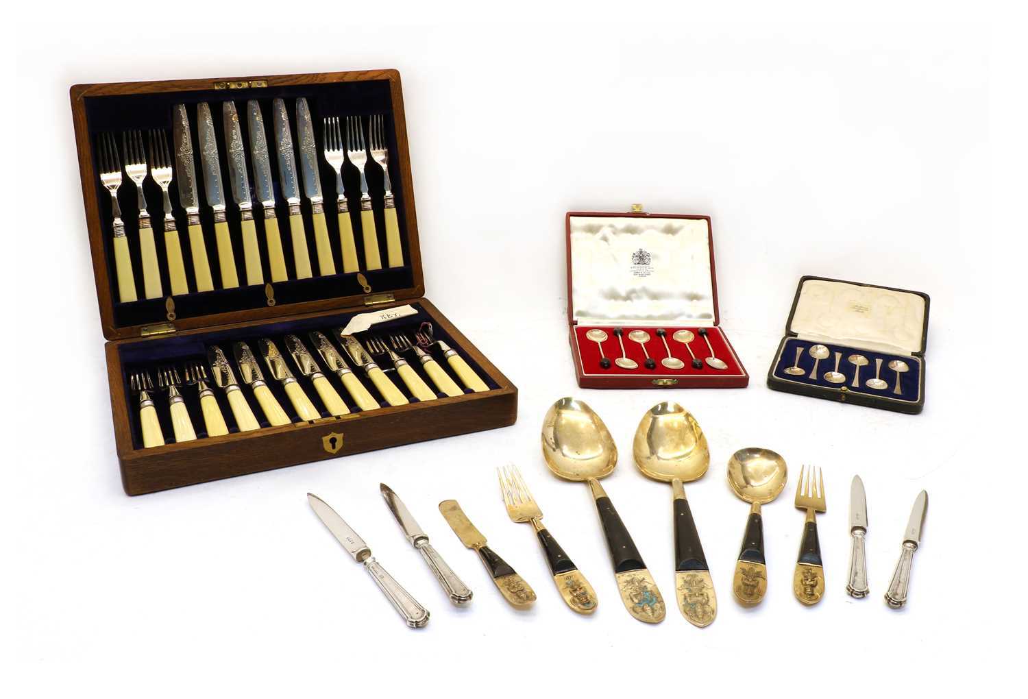 A collection of silver and silver plated flatware,