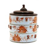 A Chinese iron-red stacking box,