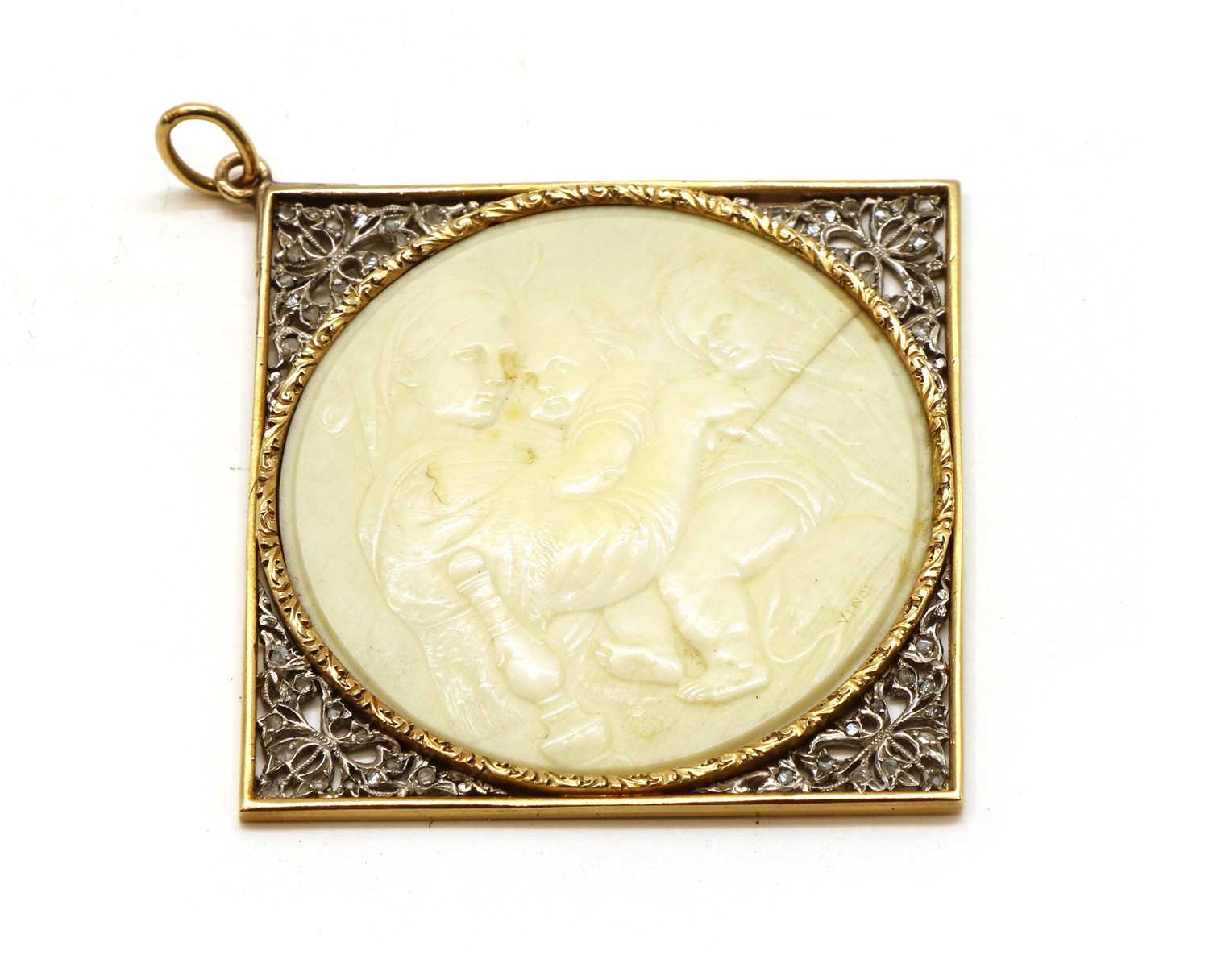 A gold and silver, ivory and diamond cameo pendant,