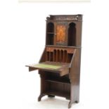 An Arts and Crafts inlaid oak bureau,