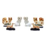 Three pairs of Staffordshire pottery dogs