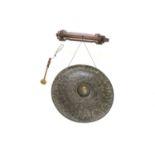 A large wall mounted hanging gong,