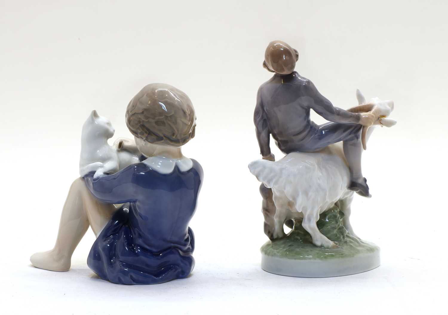 A Royal Copenhagen figure of a boy riding a goat, - Image 2 of 3