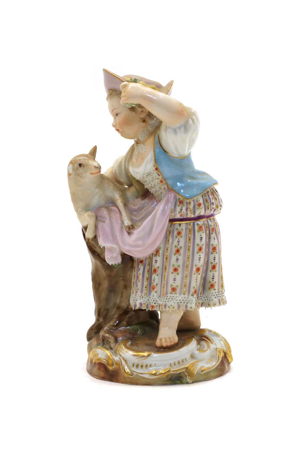 A Meissen figurine of a shepherdess with a lamb,