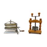 An American 'Crown' pasta maker and a French wooden press