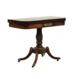 A Regency rosewood and brass card table in the manner of George Oakley,