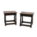 A pair of oak joined stools,