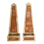 A pair of modern marble veneered obelisks