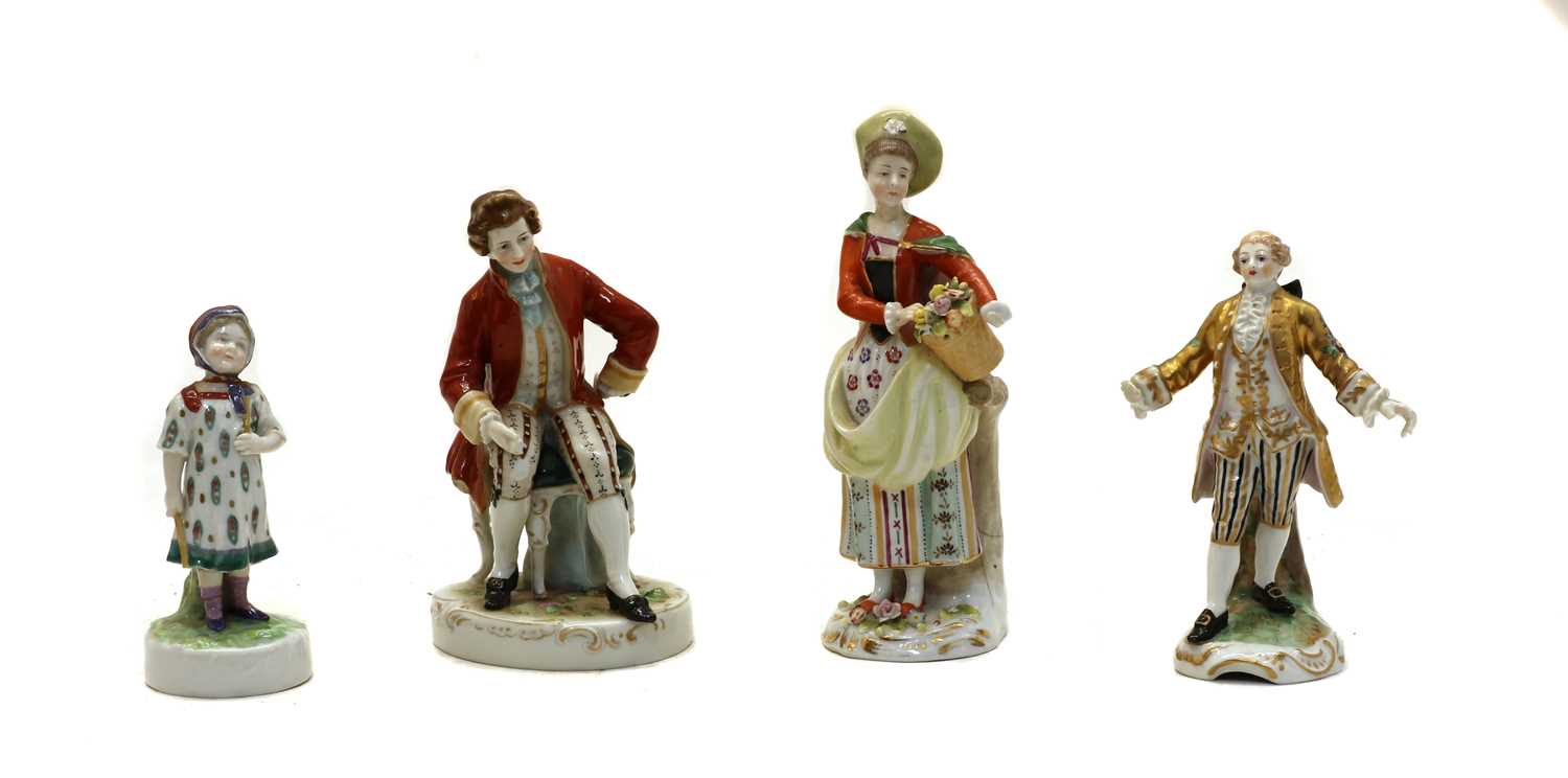 A collection of four Continental ceramic figures,