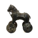 An early 20th century Indian brass wheeled model horse