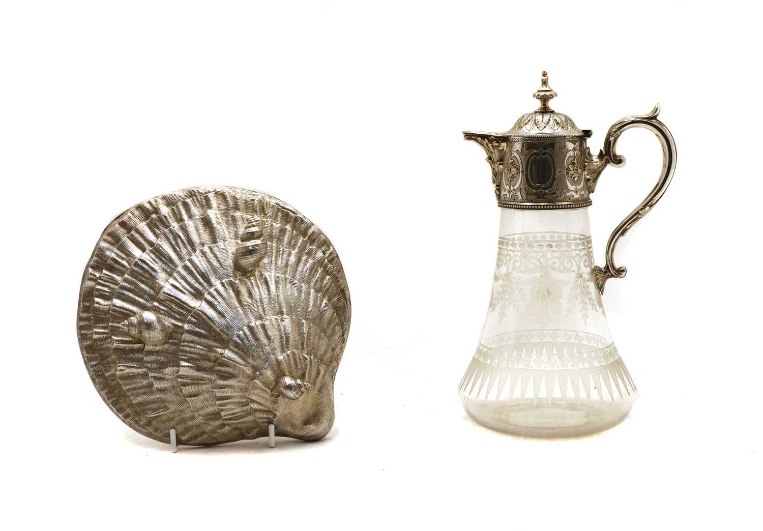 A silver plated and glass claret jug and a shell box