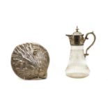 A silver plated and glass claret jug and a shell box