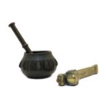 A 19th century Persian bronze pestle and mortar